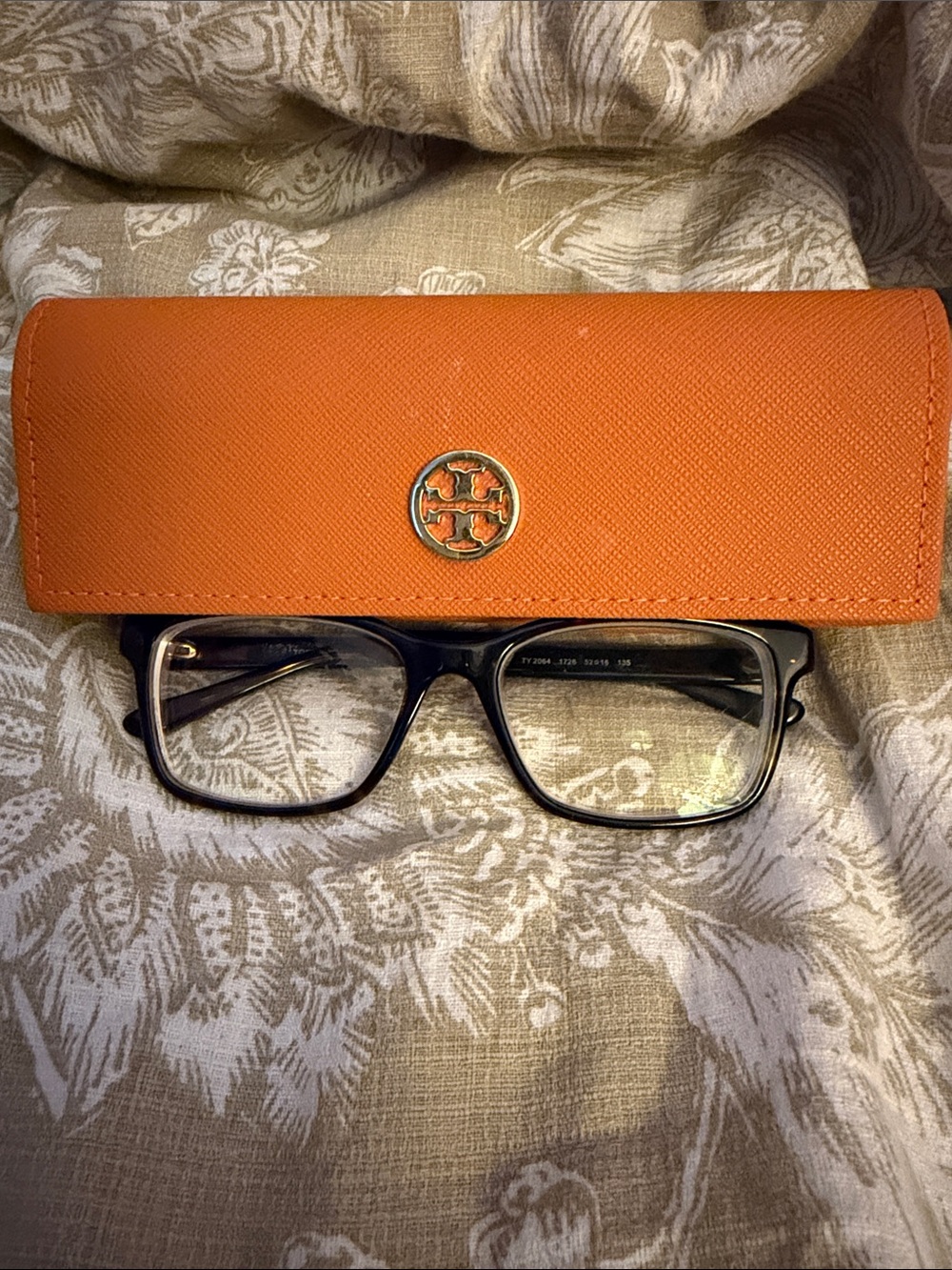 Tory Burch Orange Saffiano Leather Case with Gold Logo and prescription glasses